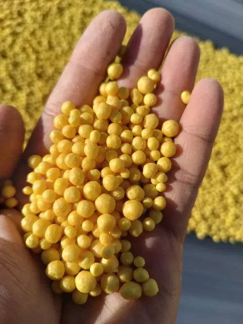Granular sulphur held in an open hand