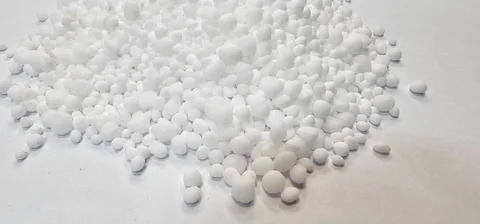Granular urea on a white surface