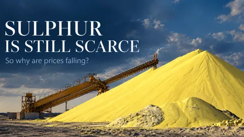 A stockpile of yellow sulphur under a conveyor, with the article title
